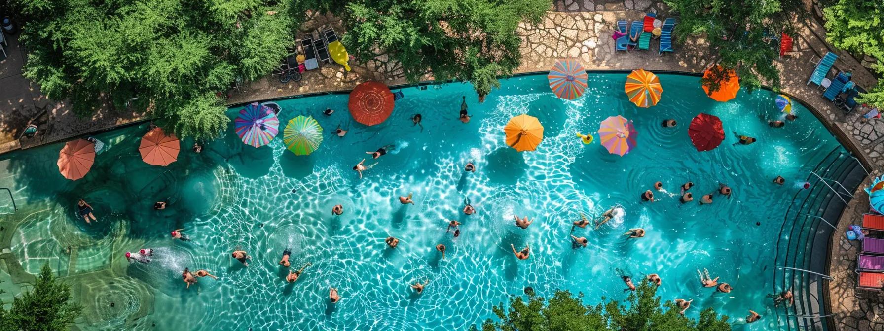 a vibrant summer scene captures sunbathers relaxing around shimmering blue pools in austin, texas, with lush greenery and colorful umbrellas creating a lively atmosphere.